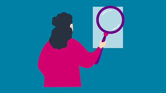 Woman with a big magnifying glass